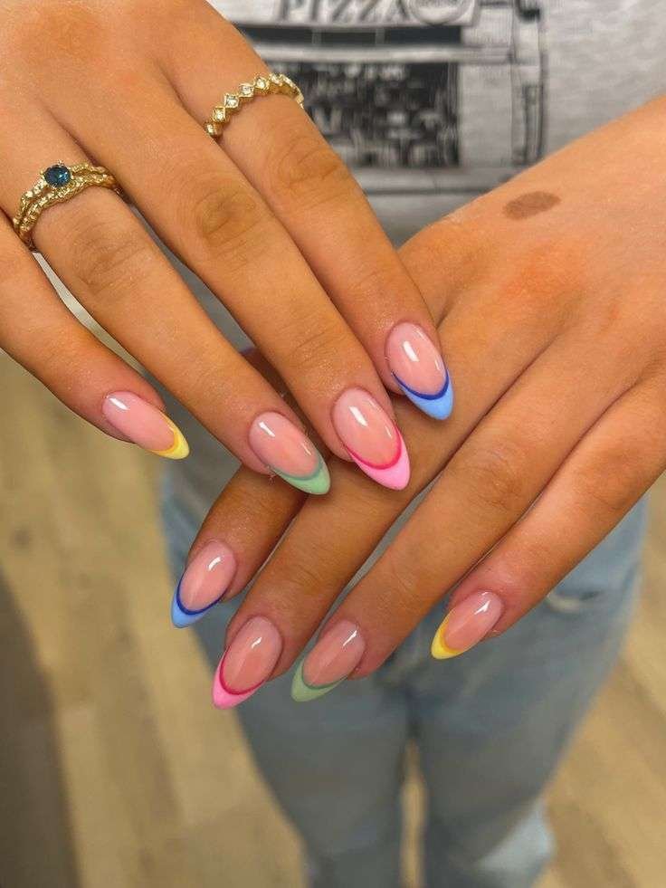 Medium nails with pastel rainbow French tips