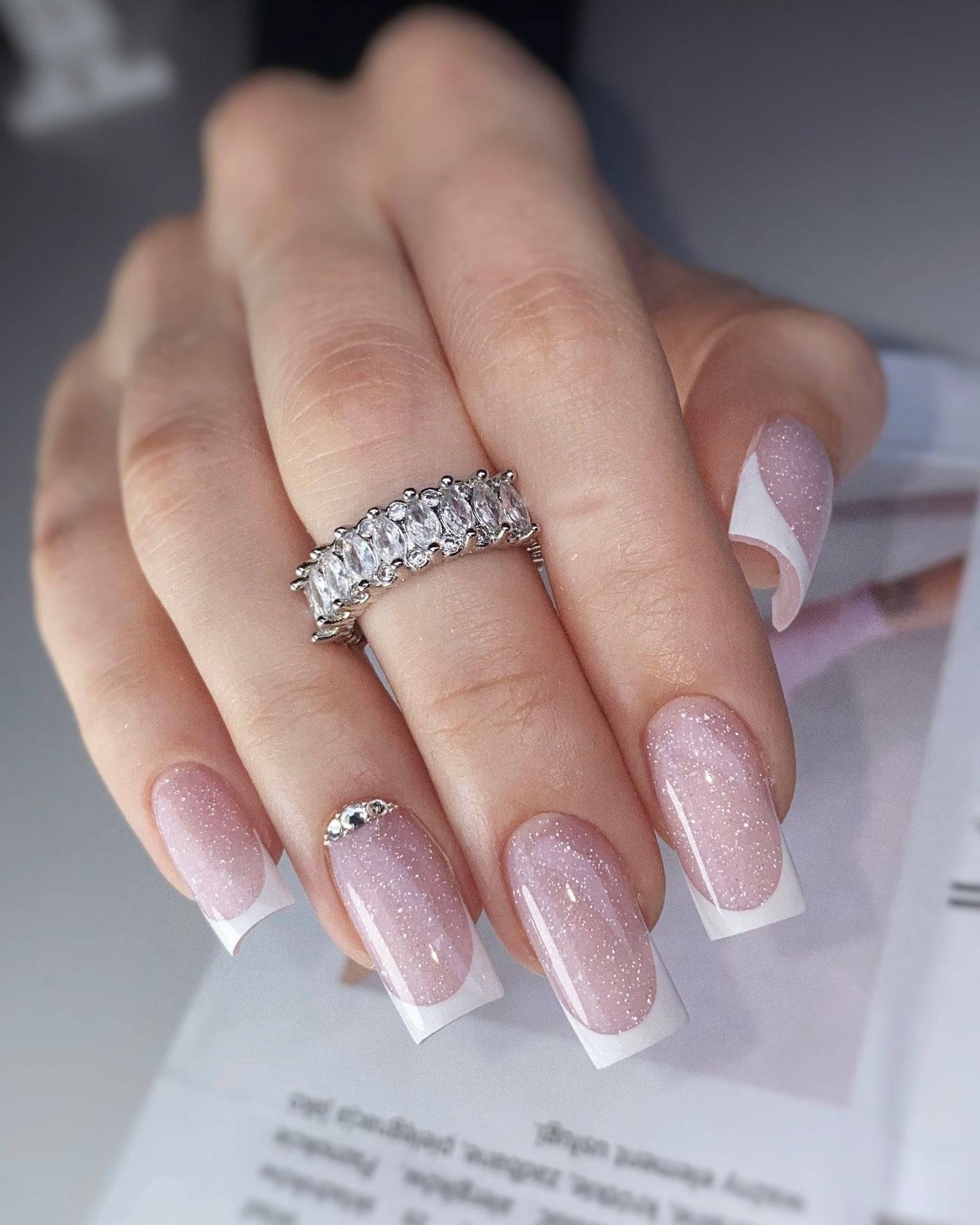 Square glittery French tip nails, classic with a twist.
