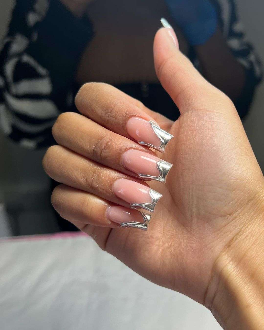 Square metallic silver French nails.