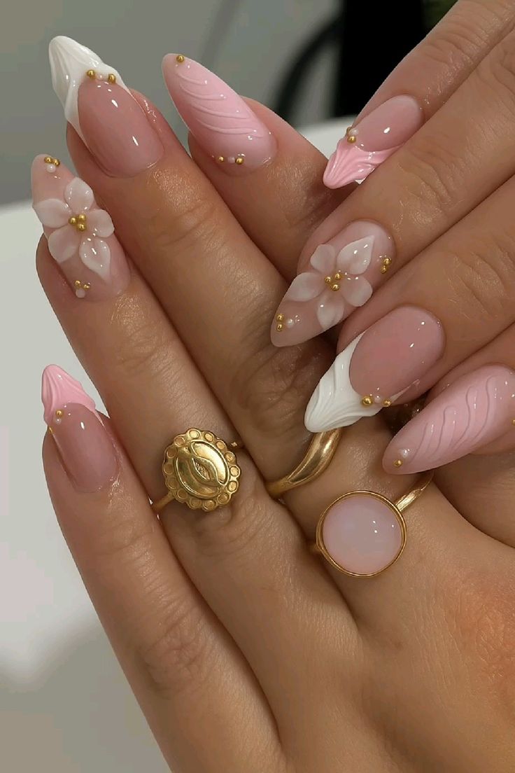 3D floral pink French tip nails.