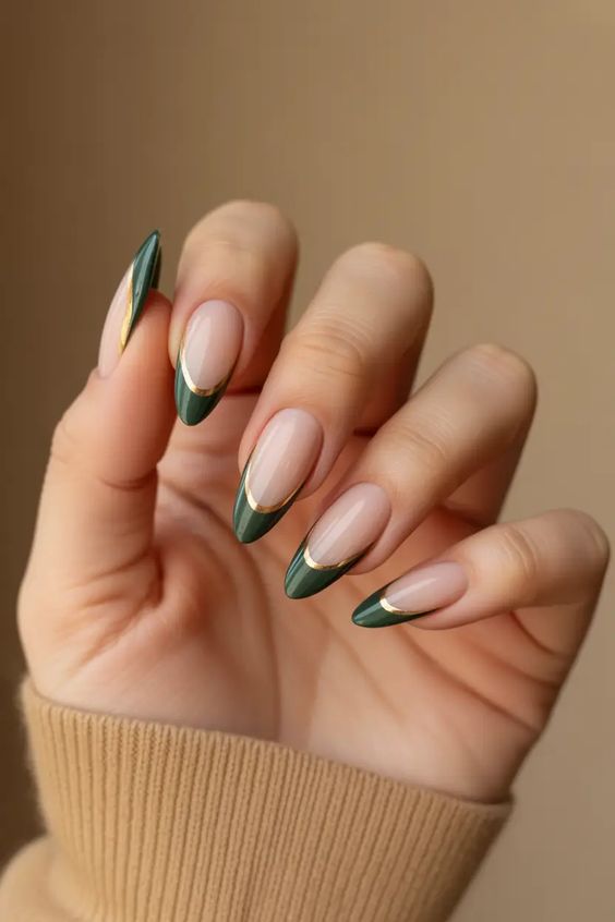 Almond green French tips with gold accents.