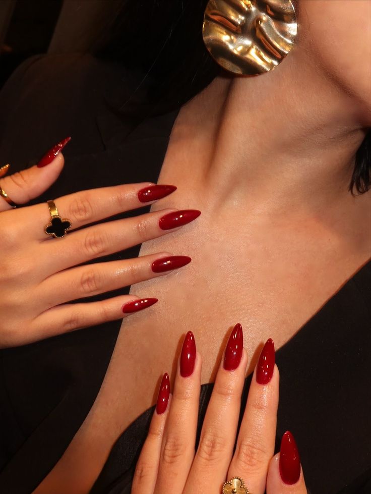 Rich red stiletto nails, bold and striking.