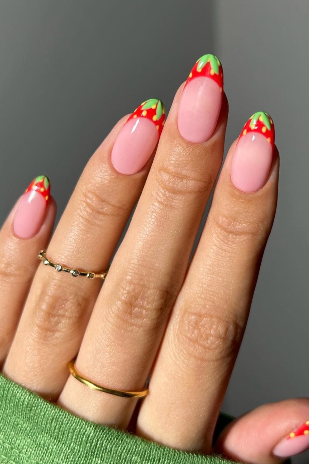 Strawberry-inspired French tips, playful and fresh.