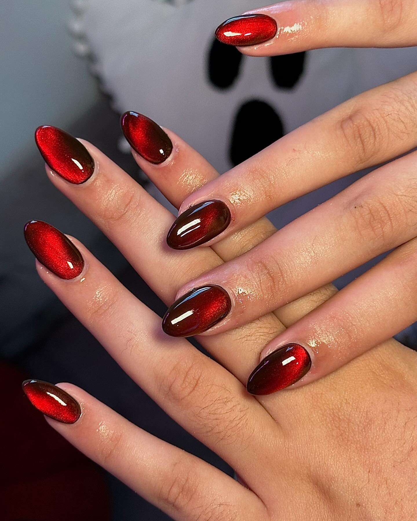 Glossy red velvet nails, rich and luxurious.