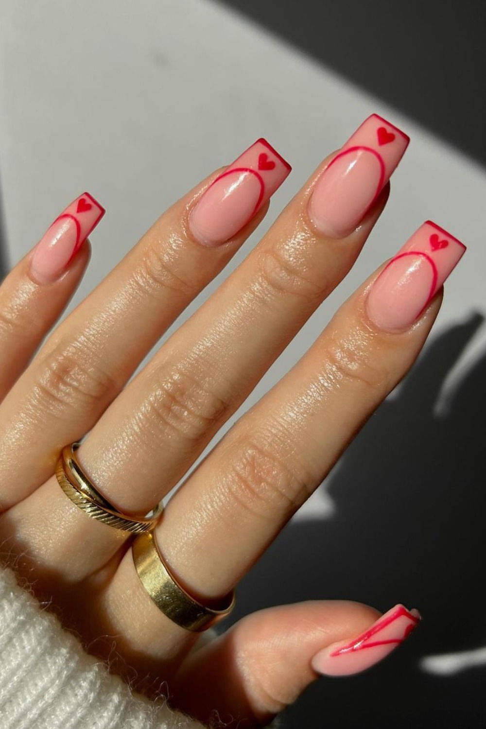 Red heart French tips on coffin nails, romantic and chic.