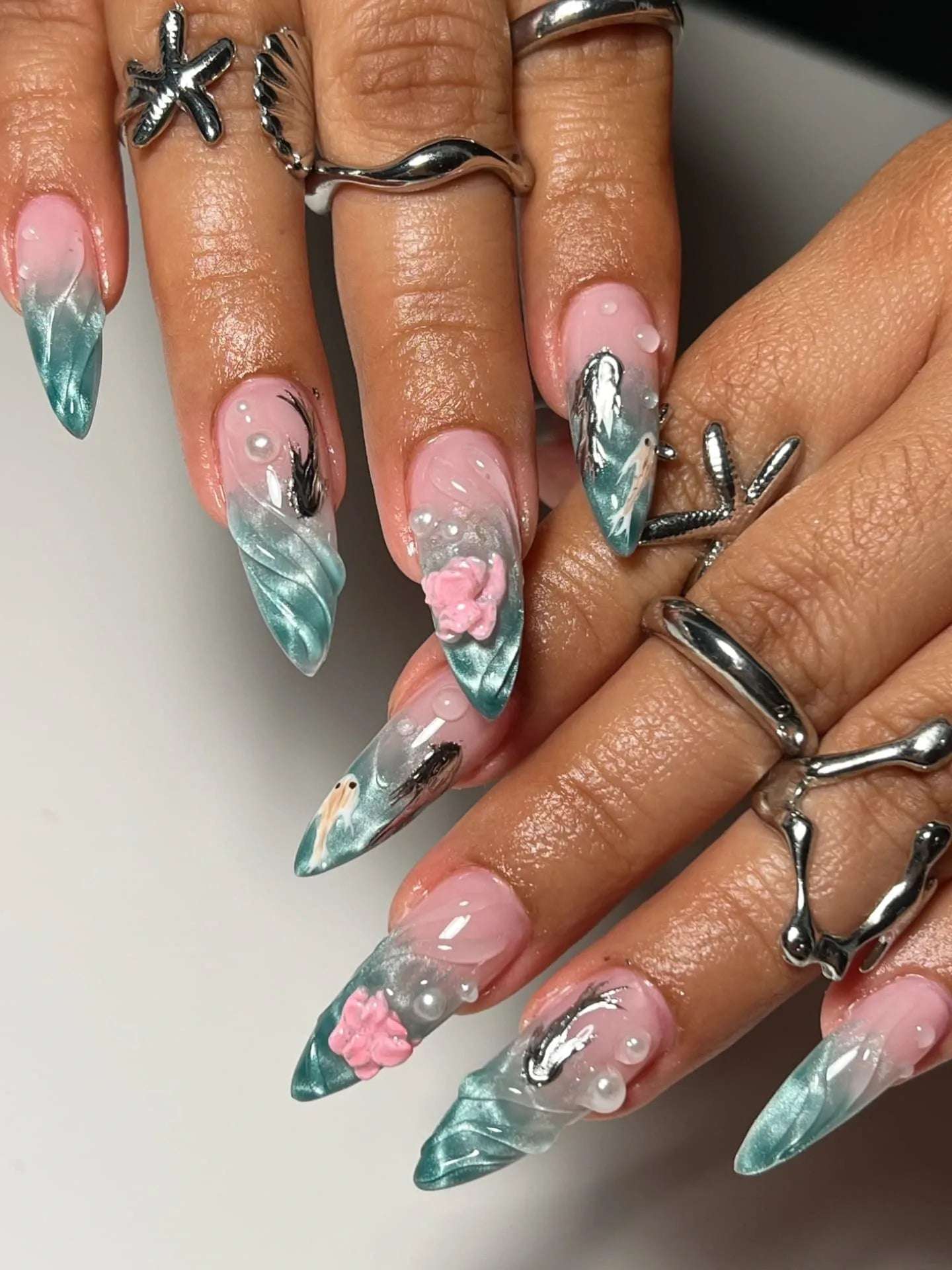 Stiletto nails with ocean-themed 3D art