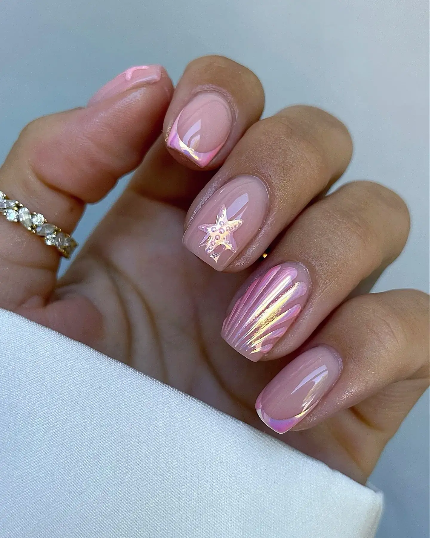 Square nails with pink starfish design