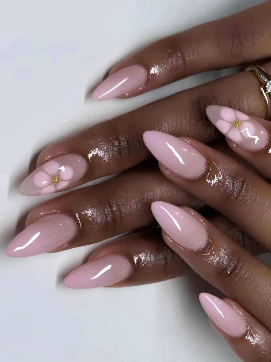 Pink almond nails with floral accents