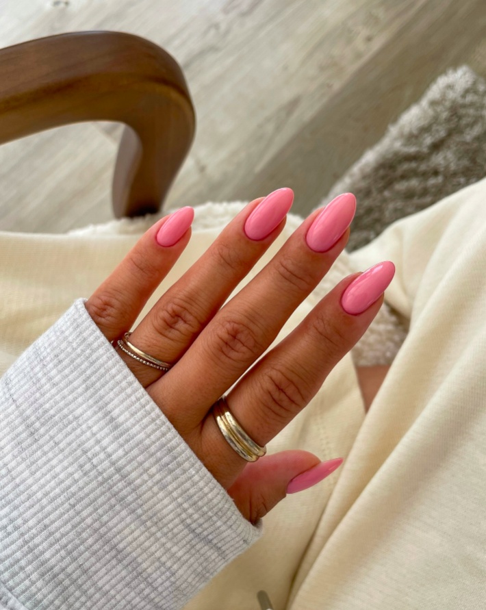 Pink almond nails with glossy finish