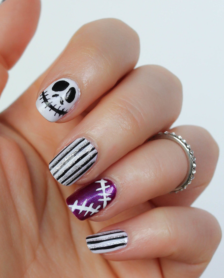 Easy halloween nails showcasing cat eye halloween nails, halloween nail art designs, whimsigoth nails, black and white theme.
