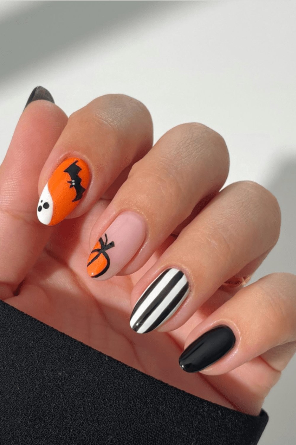 Crazy halloween nails featuring halloween cat nails, purple and black nail ideas, unique, cute style.