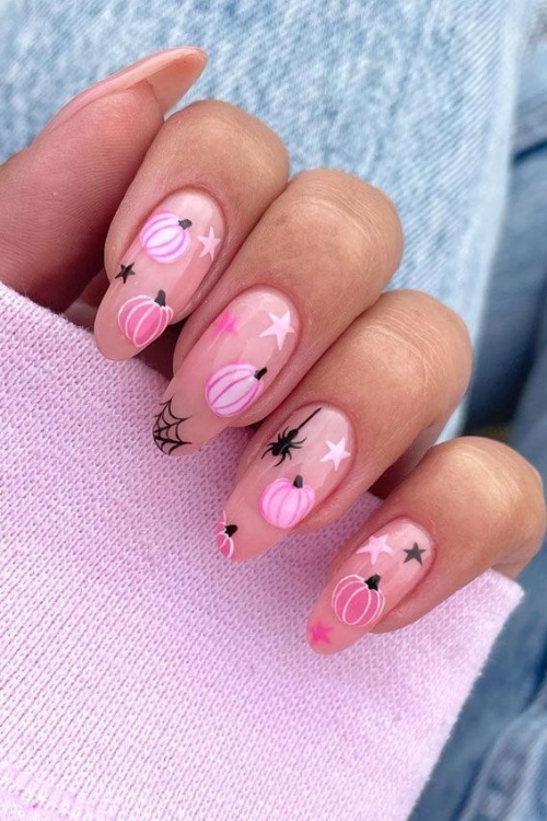 Orange halloween nails and cute halloween nails featuring bat nails, witchy, creative designs.