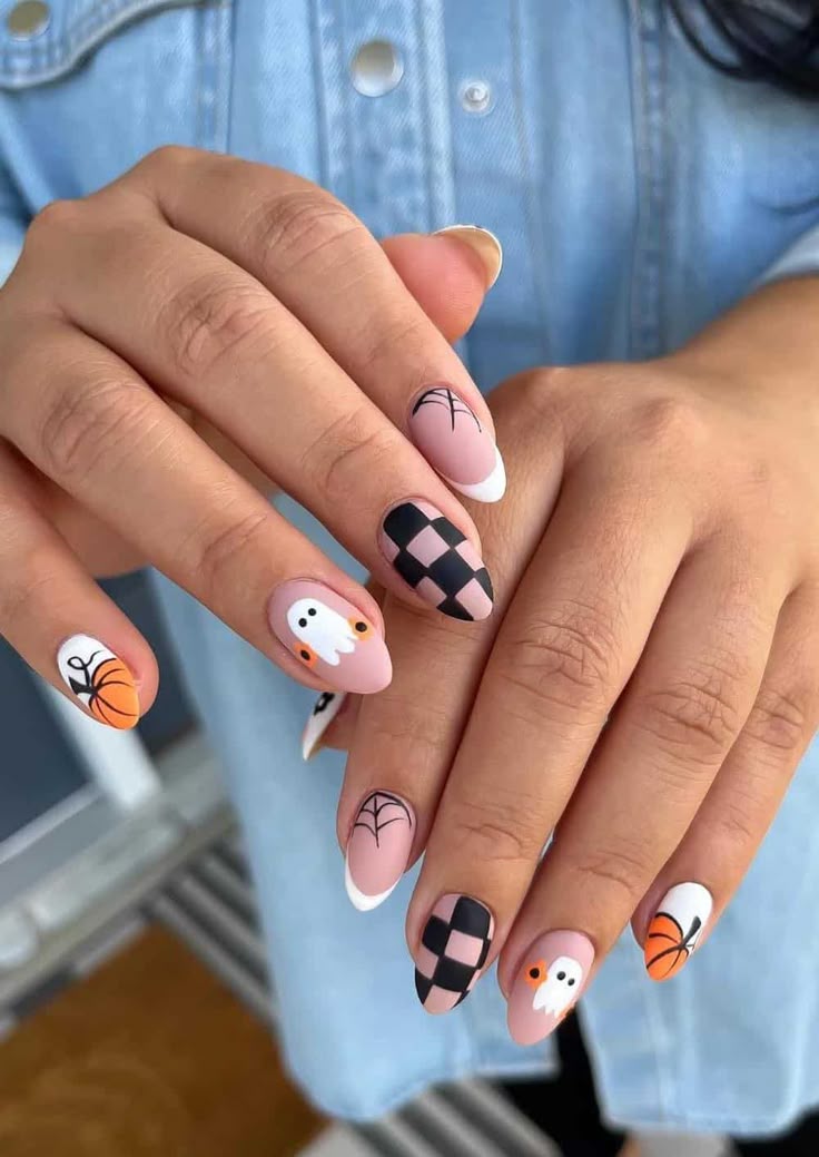 Disney halloween nails design with simple halloween nails, purple witchy nails, orange and black, classy style.