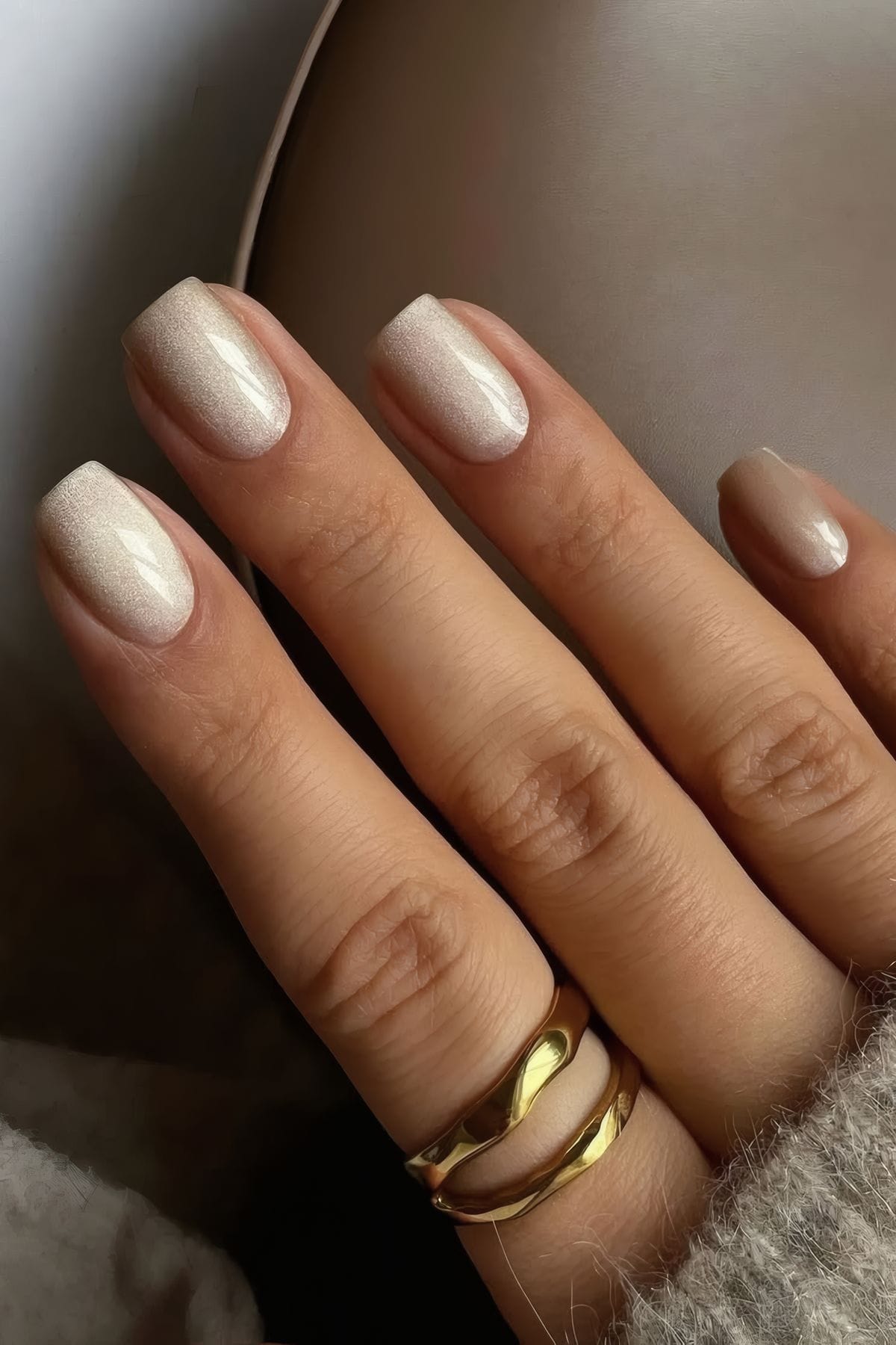 summer almond nails transitioning to winter almond nails, with a short oval shape and cherry red nails trending for spring shape.