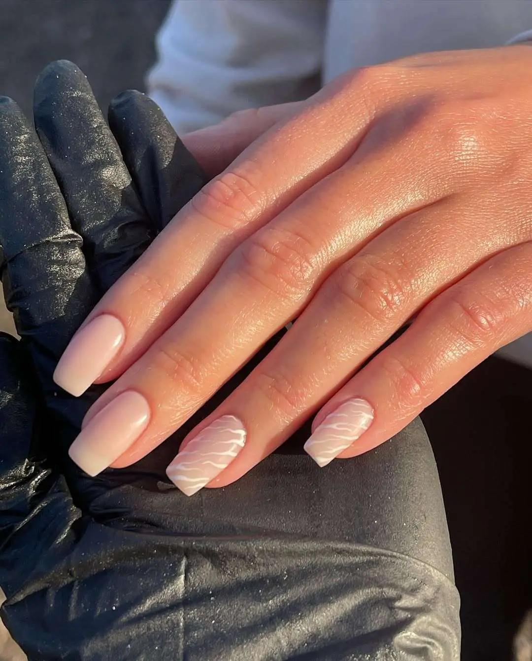 Soft pink nails with subtle design details