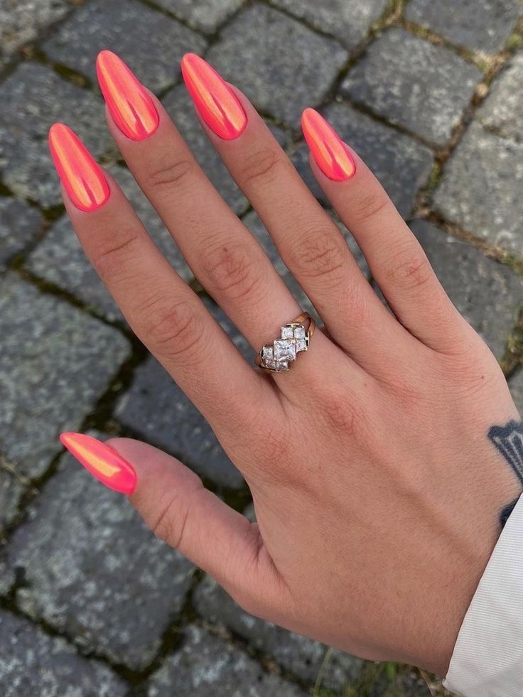 Bright coral stiletto nails