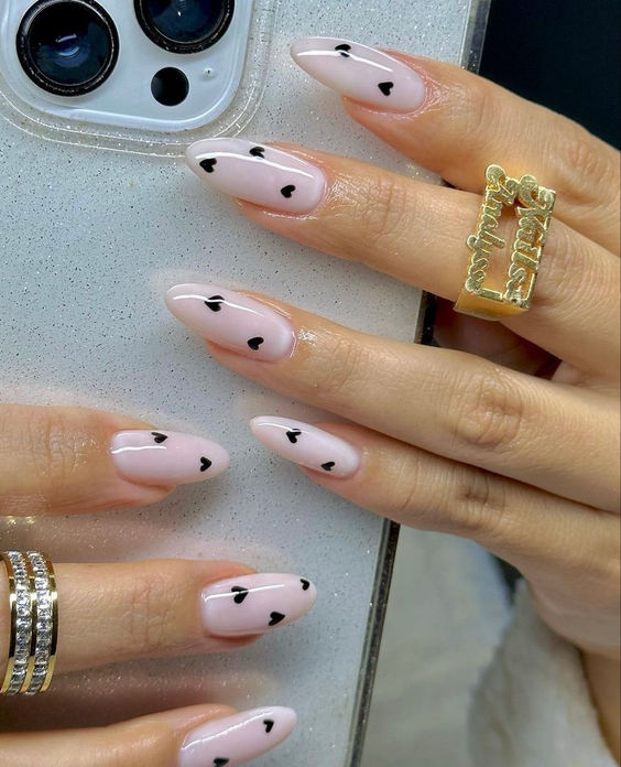 Pink nails with black heart details