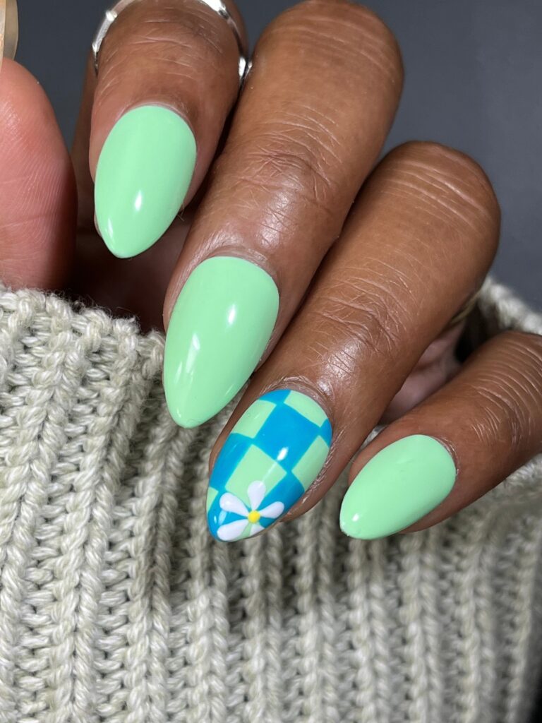 Mint green nails with checkered accent