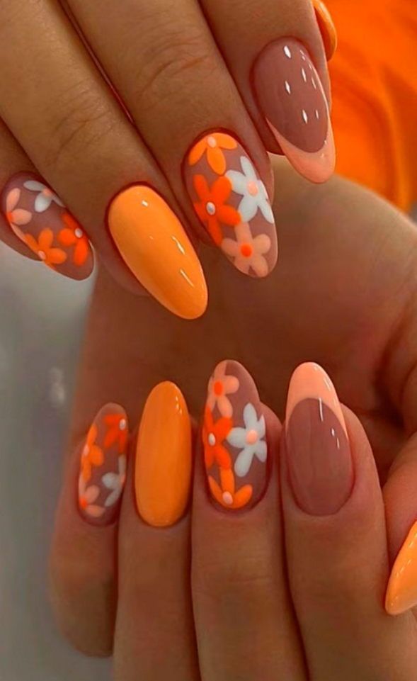 Bright orange floral nails with almond shape