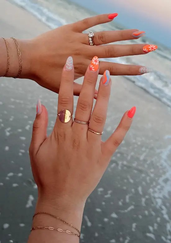 Tropical nails with floral accents in almond shape