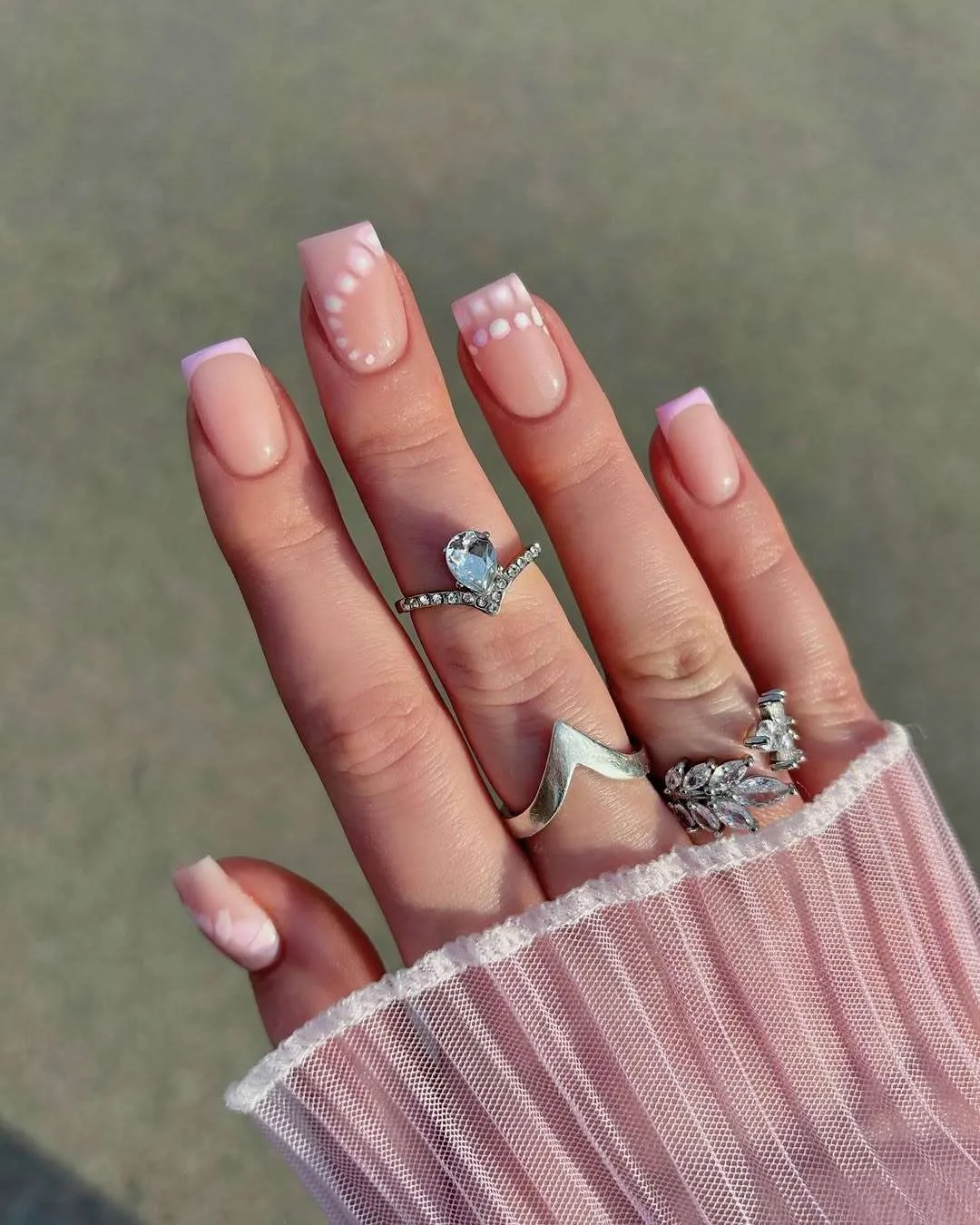 Pink nails with polka dot accents in square shape