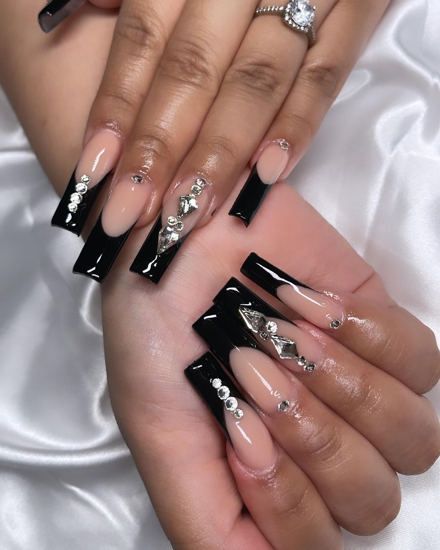 Refined black french tip nails with design, red and black nails design, black french manicure, and silver, and white french tip.