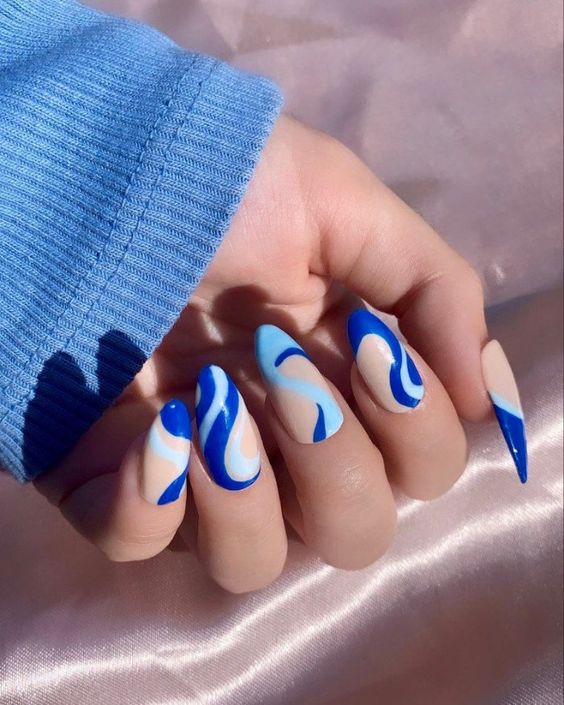 Blue prom nails with blue green nails, purple and pink nails, red white and icy design