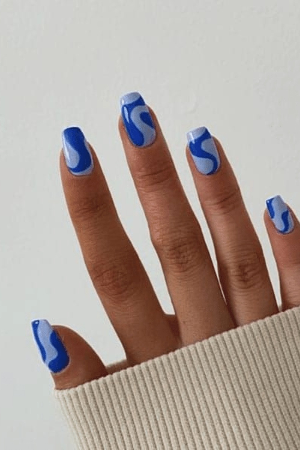 Black and blue nails with blue tip nails, light baby blue nails, short and white floral style