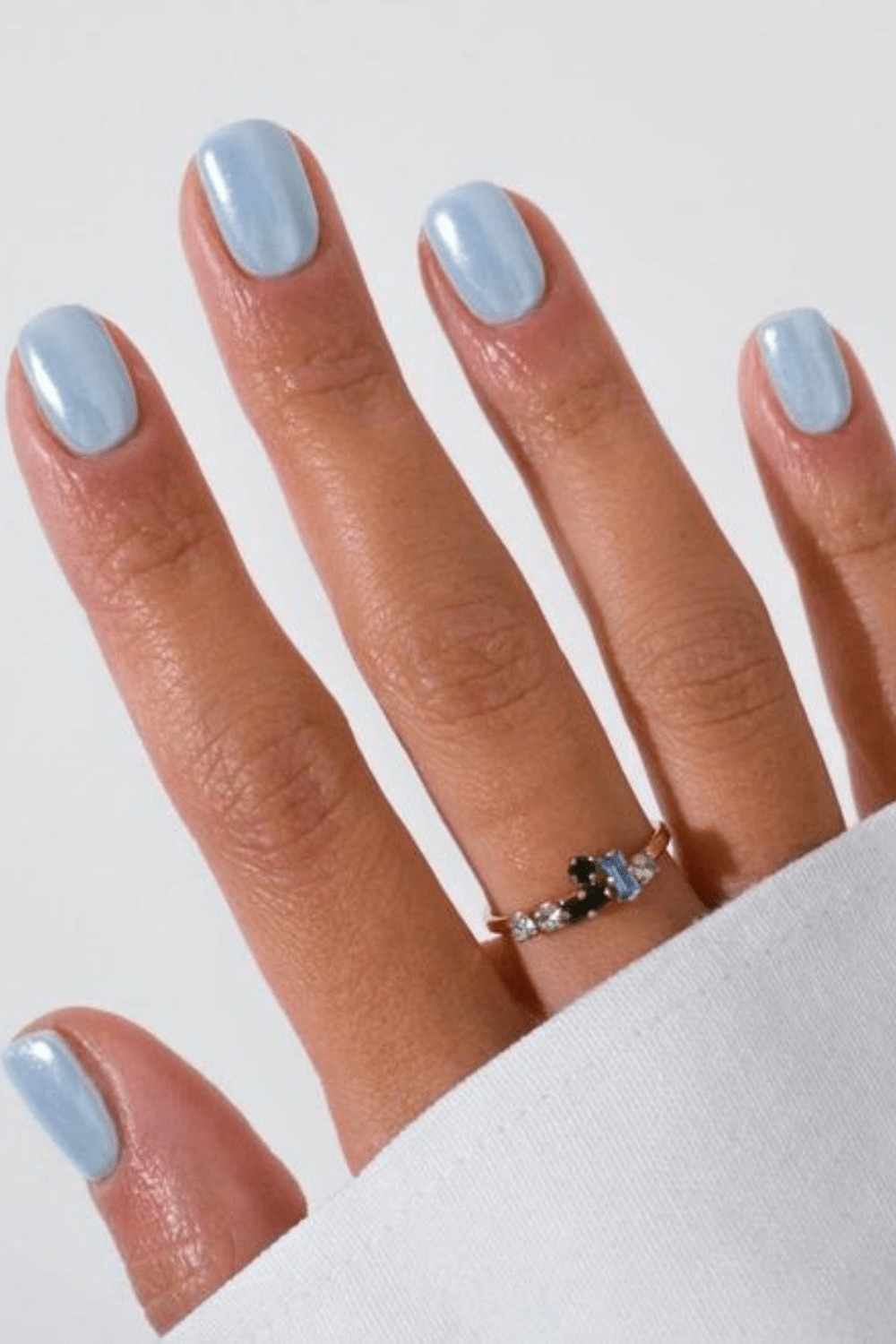 Midnight blue nails with powder blue nails, lemon and blue nails, and silver white accent