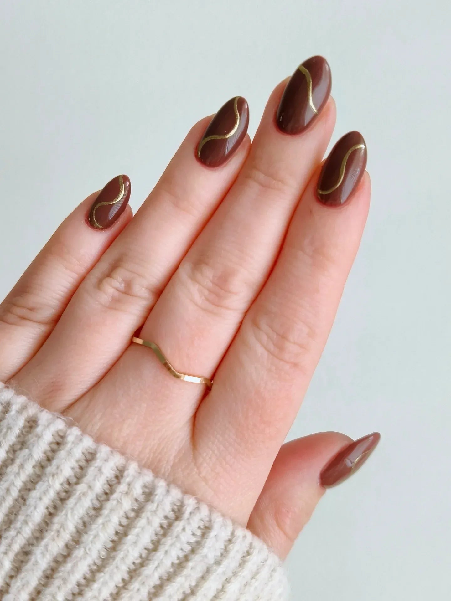 Short brown nails, brown stiletto nails, winter nails, nail inspo, and gold skin with gold accents