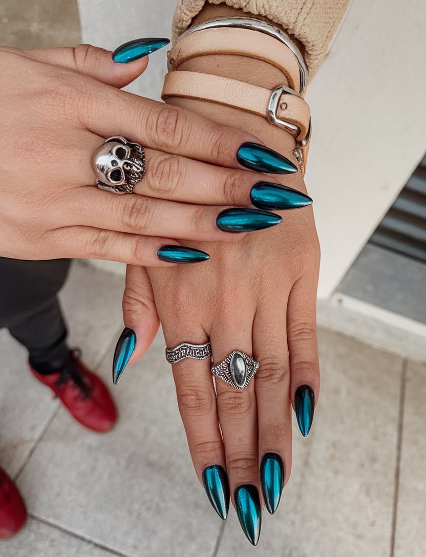 Vibrant teal chrome stiletto nails