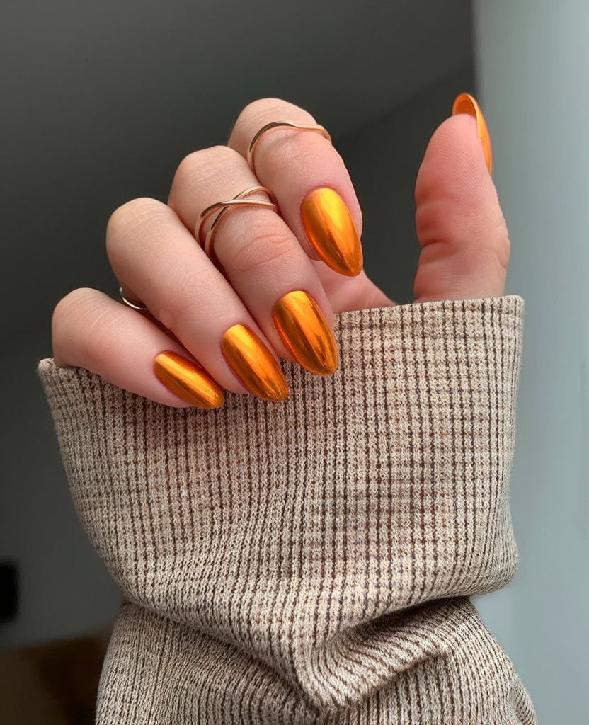 Fiery orange chrome nails with high gloss