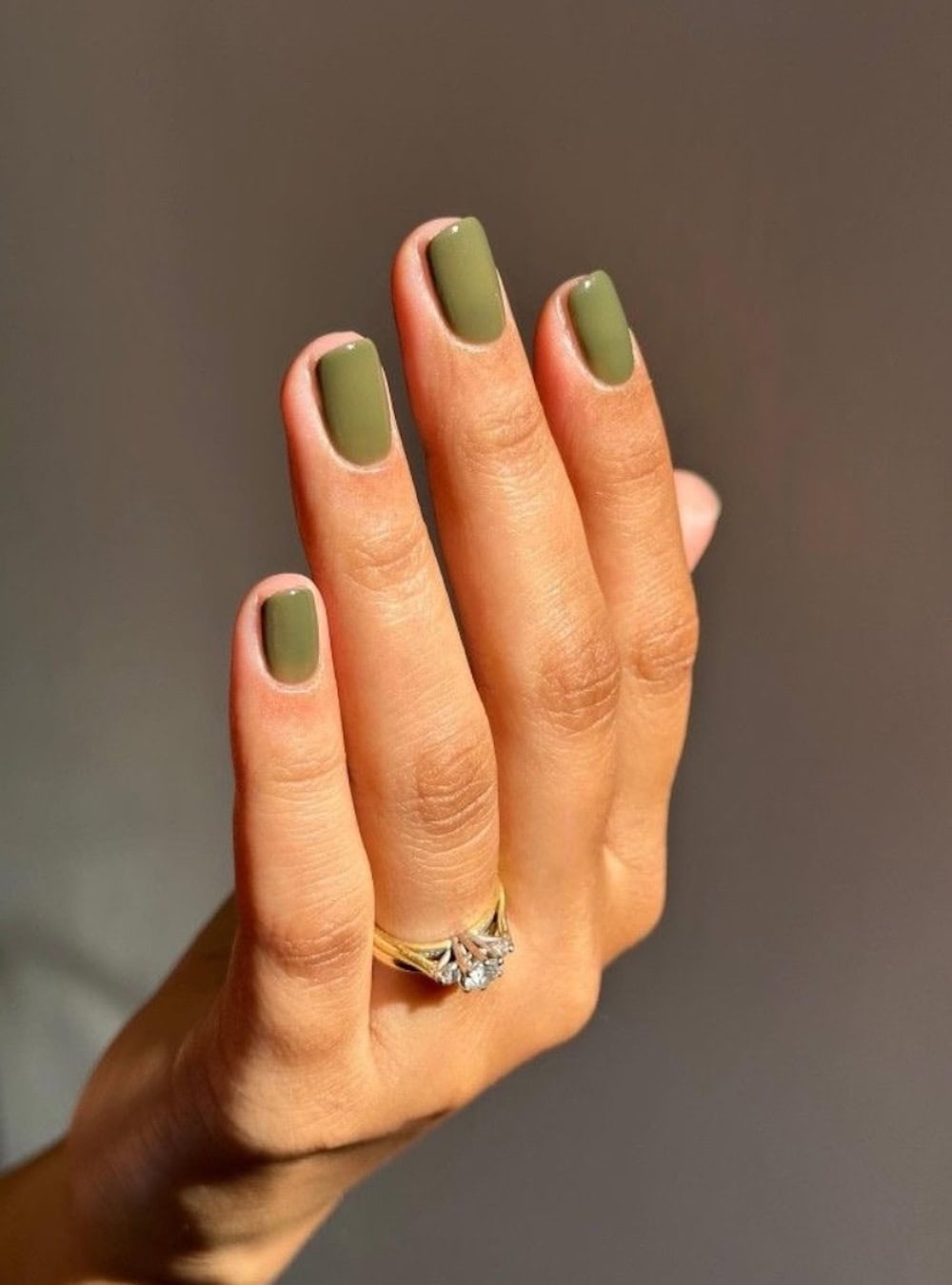 Matte olive nails with a short square shape