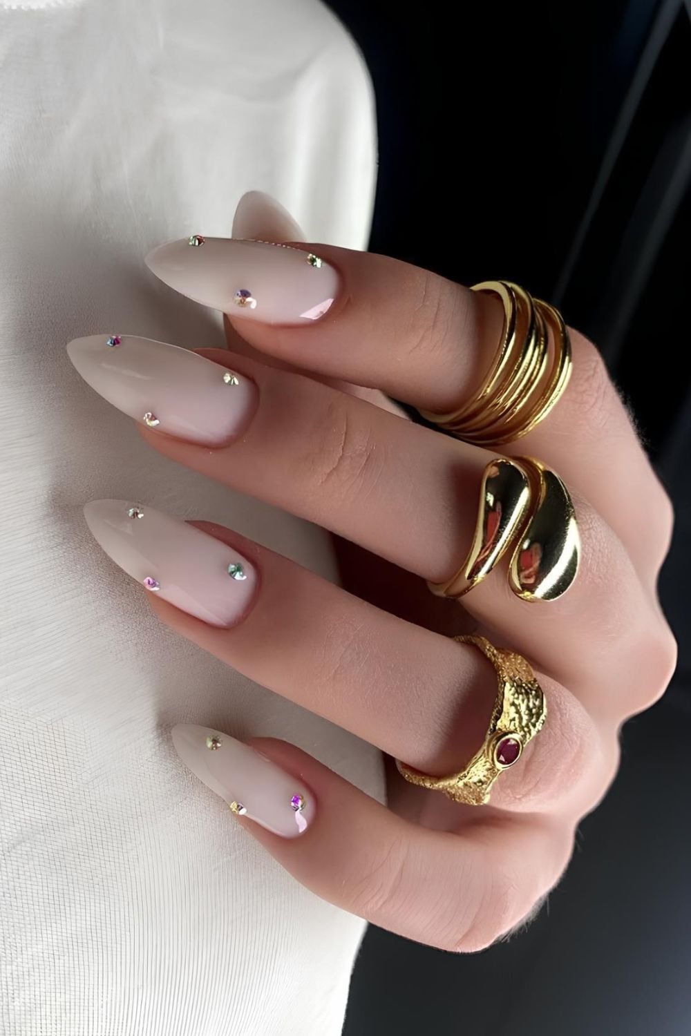 Milky white coffin nails, milky white nails with black design, white on white french tip nails, toe, and silver