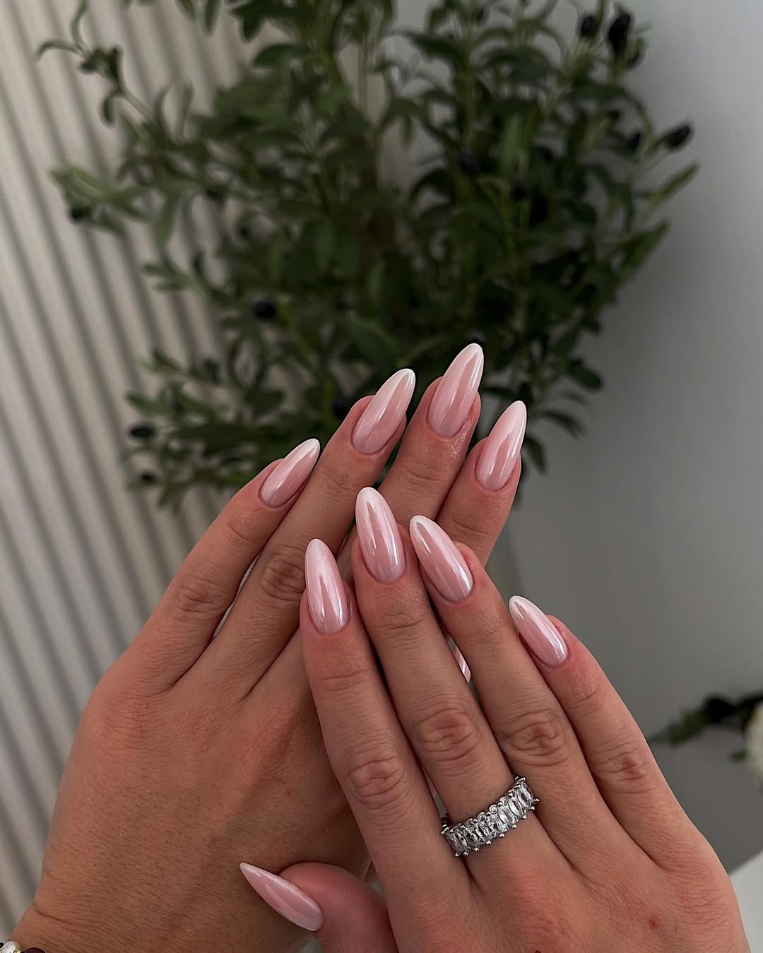 Soft nude nails with minimalist trendy 2026 design in brown pink sparkly style.