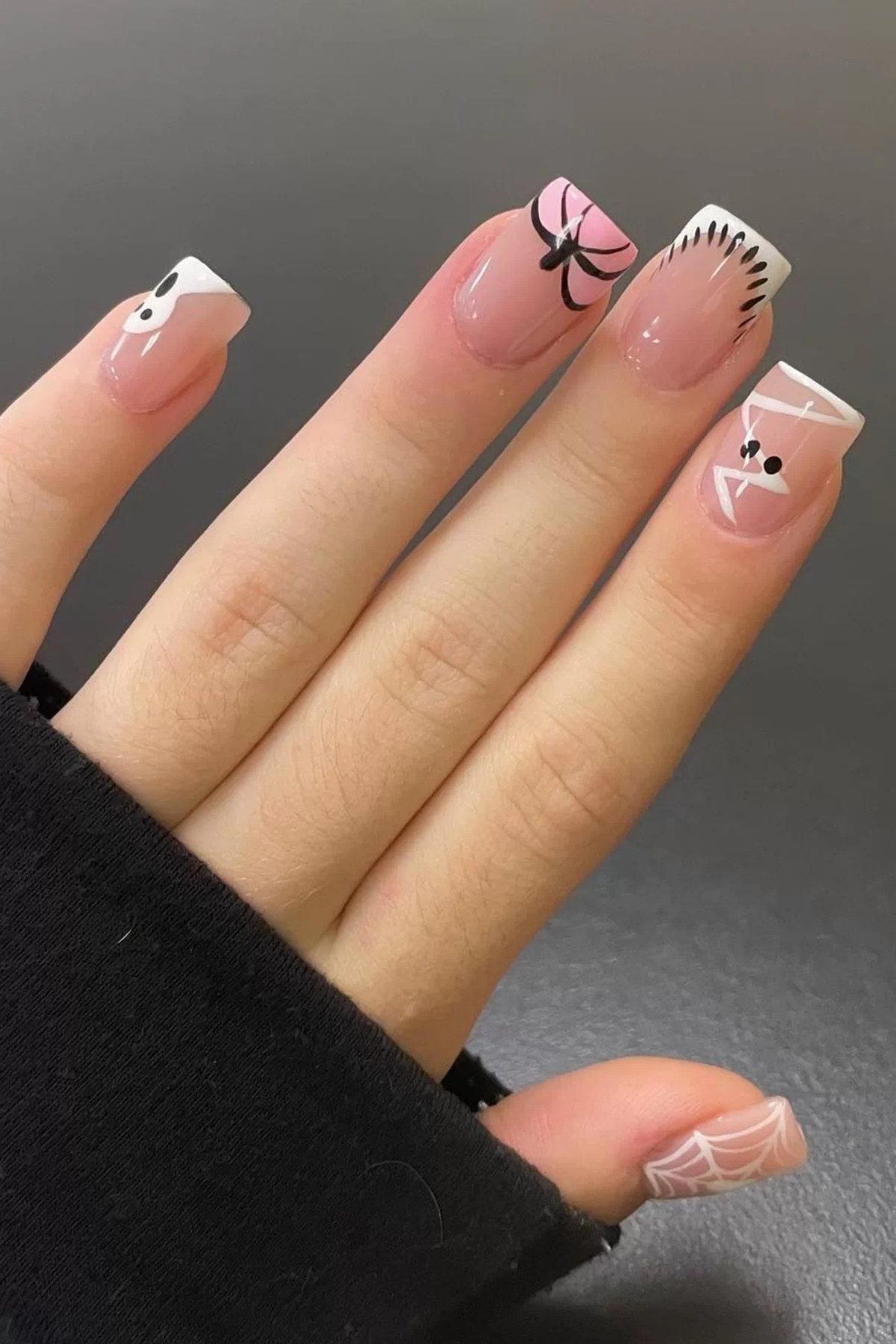 Pink scream nails with cute halloween acrylic nails, showcasing bold scream artistry.