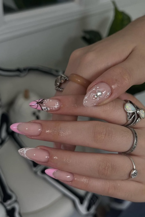 Pink ghostface nails with black pink halloween nails.