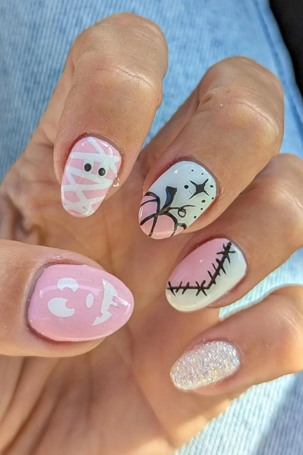Clown nails with pink october nail art theme.
