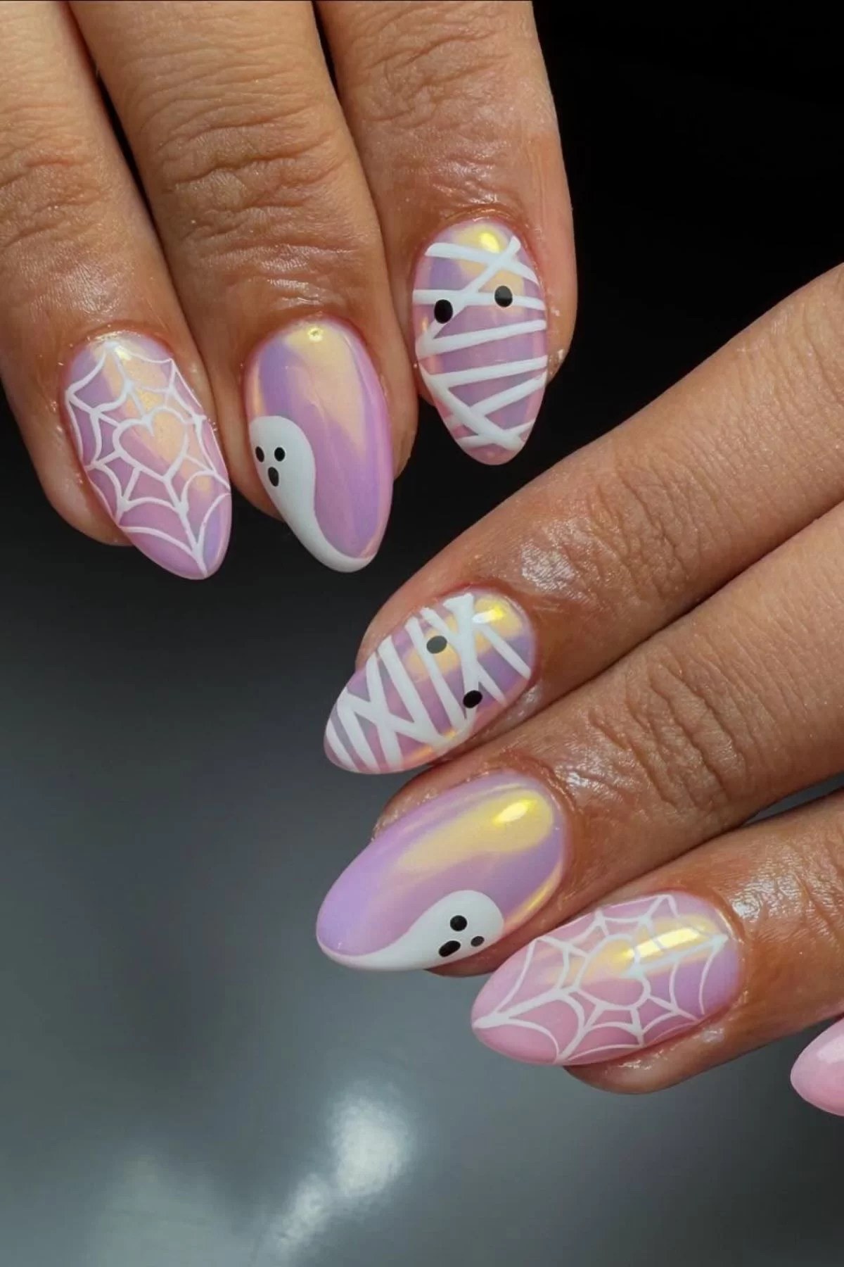Black and purple halloween nails with short length.