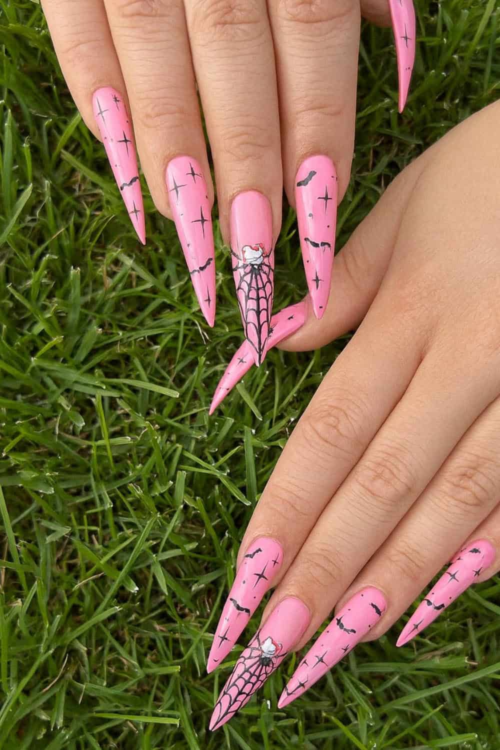 Pink halloween nail designs with creative flair.