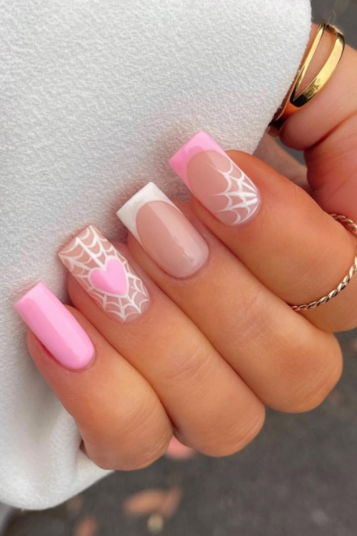 Purple halloween nail designs with webbed elegance.