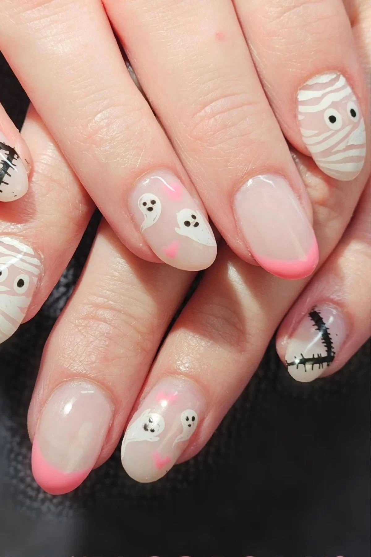 Cute halloween nail ideas with ghost motifs.