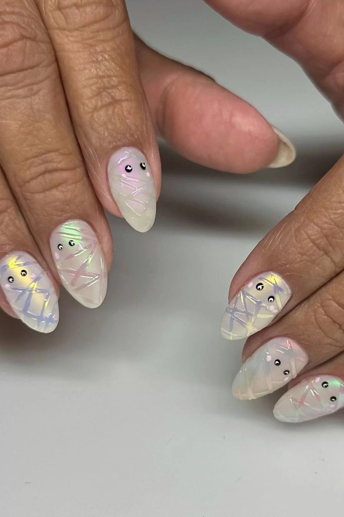 Cute hello kitty nails with detailed designs.