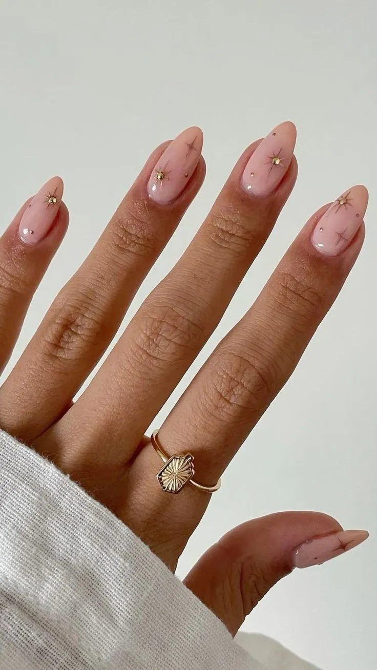 Baby pink nails with pastel pink nails, showcasing pink nails inspiration and spring cat eye nails. Suitable for valentines day or a spooky theme.
