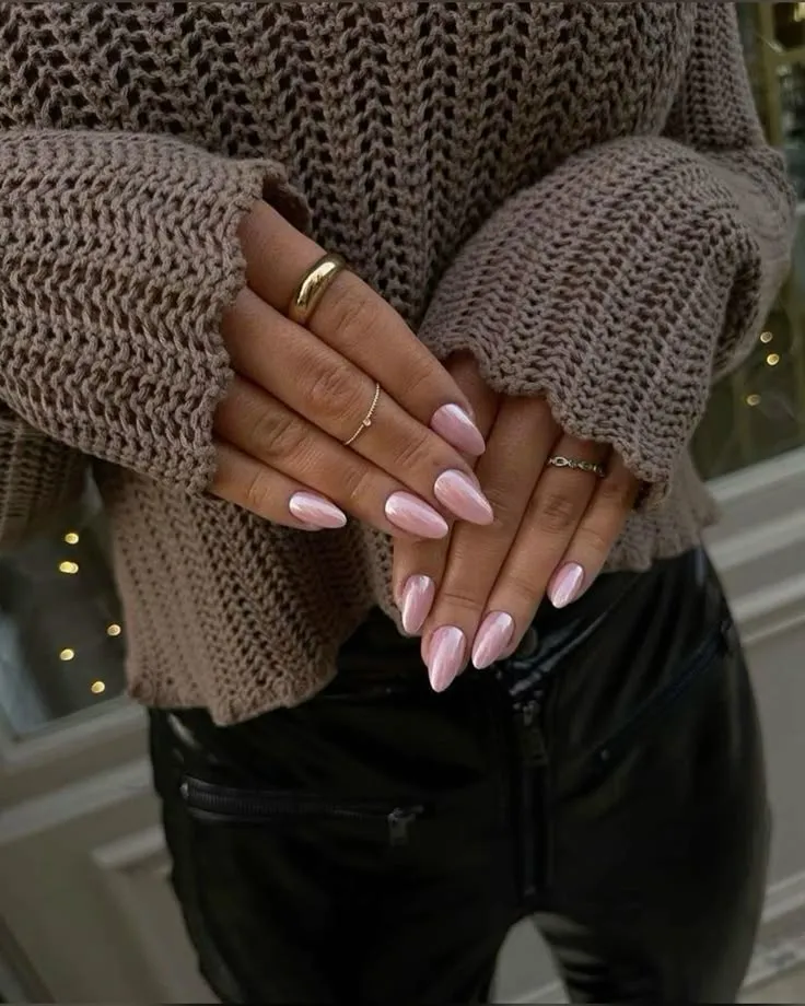 Pink french tip nails with milky pink almond nails, featuring simple pink nails and short nail designs in a stiletto shape with pearl accents.