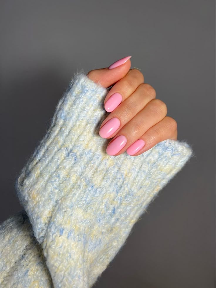 Pink christmas nails featuring hot pink nails with design, hot pink french tips, almond nails with design, and a touch of square and green.
