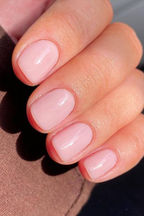 Pink and orange nails with light pink nails with design, bright summer nails, and coffin shape.