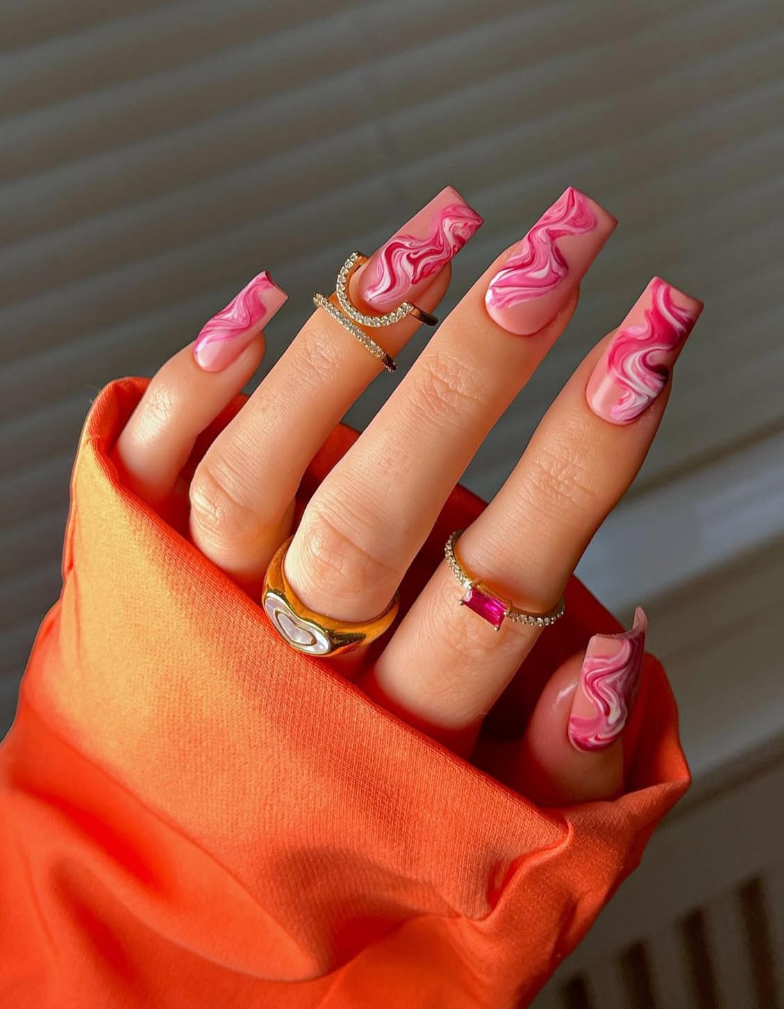 Pink and red nails with pink prom nails, featuring pink winter nail designs, christmas theme, and a hot look with details.