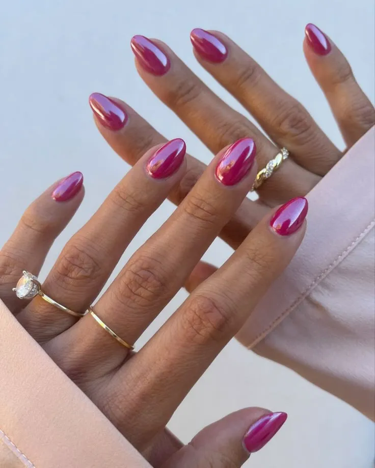 Neon pink nails with pink spooky nails, featuring pinky nude nails in ombre and marble style.