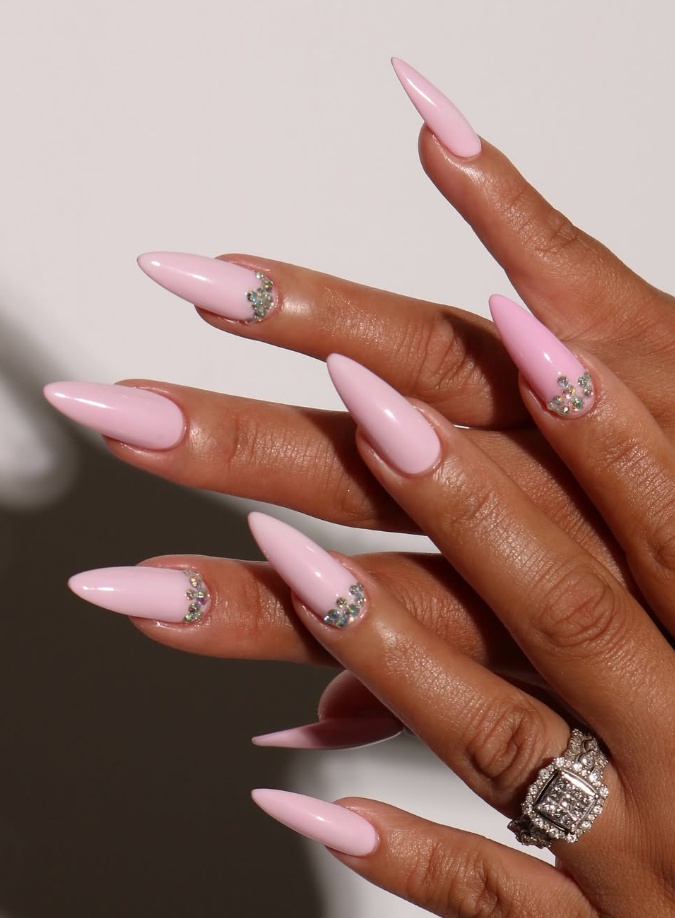 Pink gel nails with pink green nails, featuring tropical nails with glitter and white accents.